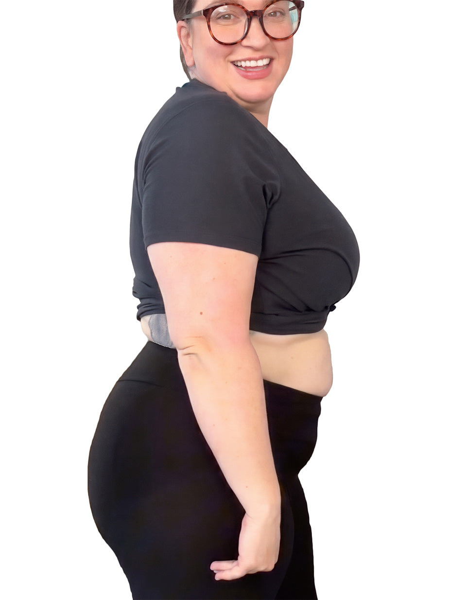 Person wearing a black outfit on a white background