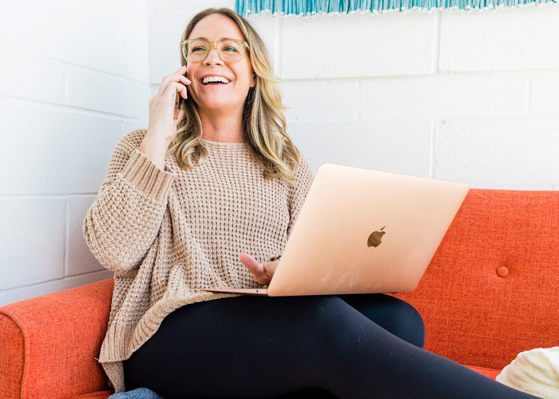 Happy woman on the phone ordering a subscription