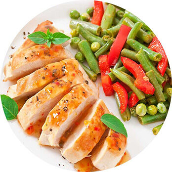 Roasted chicken with asian dressing paired with steamed veggies