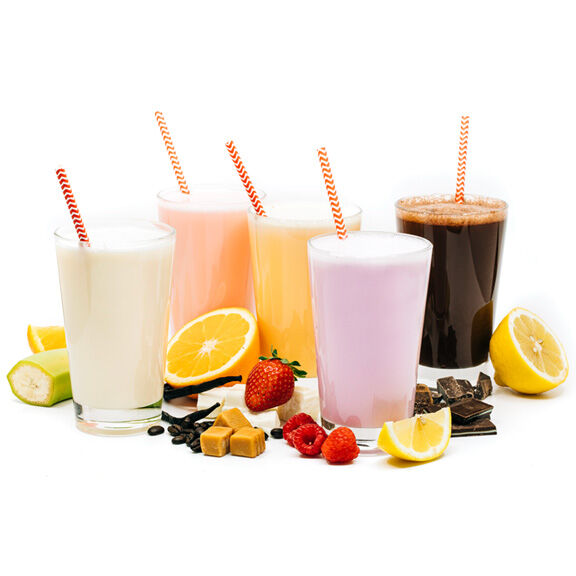 Variety of flavors of protein shakes in glasses with straws and flavor elements.