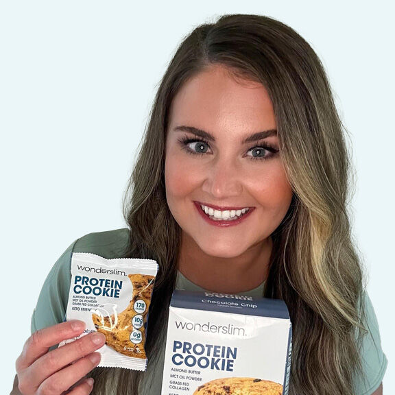 Wonderslim Ambassador holding Wonderslim Protein Cookie, Chocolate Chip